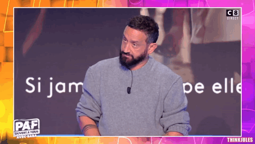 Man With Beard Standing In Front Of Paf Screen GIF