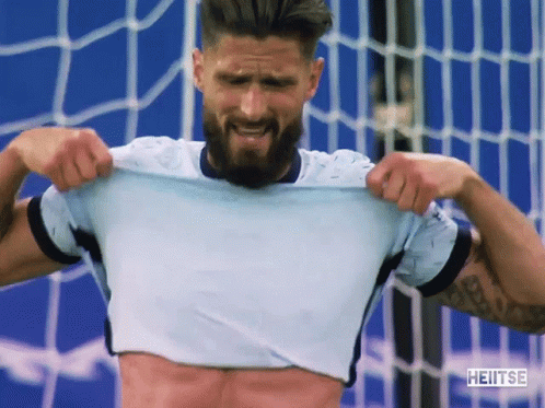 Man With Beard Taking Off Shirt Heitse