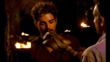 Man with Beard Talking by Fire
