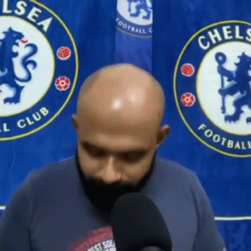 Man with Beard Talking Into Microphone