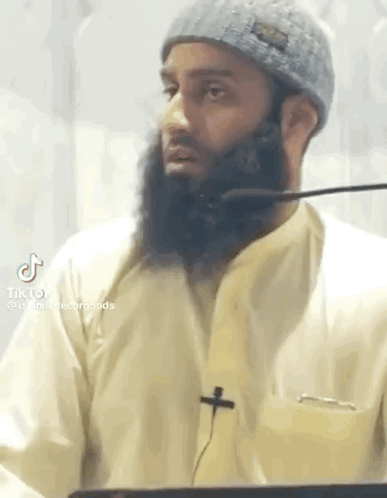 Man With Beard Talking Into Microphone