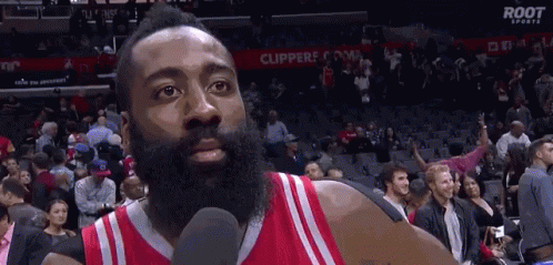 Man With Beard Talking Into Microphone