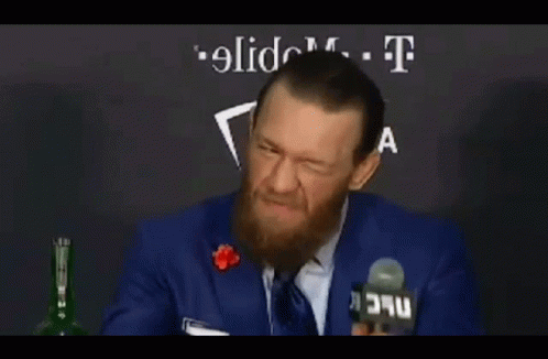 Man with Beard Talking Into Microphone