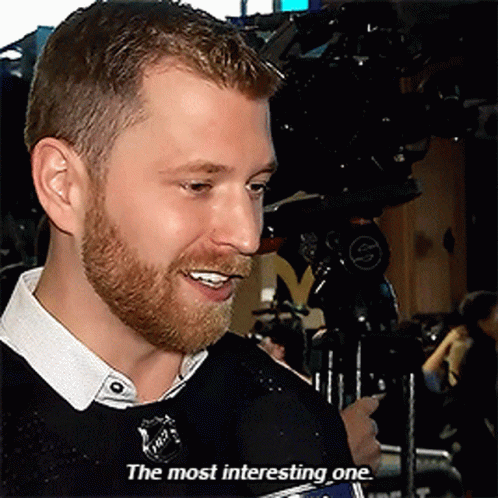 Man With Beard Talking Into Microphone Saying The Most Interesting One