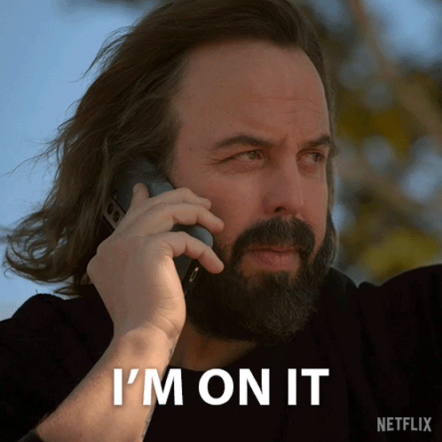 Man with Beard Talking on Phone