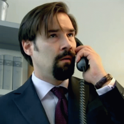 Man With Beard Talking On Phone GIF
