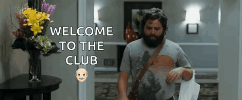 Man with Beard Walking Through Hallway