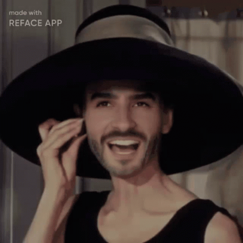 Man with Beard Wearing Black Hat Smiling