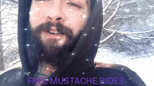 Man With Beard Wearing Black Hoodie Saying Free Mustache Rides