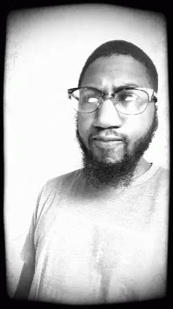 Man With Beard Wearing Glasses and Grey Shirt