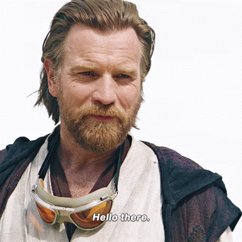 Man With Beard Wearing Goggles and Hello There Shirt