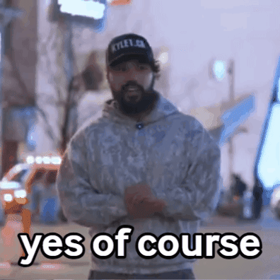 Man with Beard Wearing Hat and Sweatshirt Saying Yes