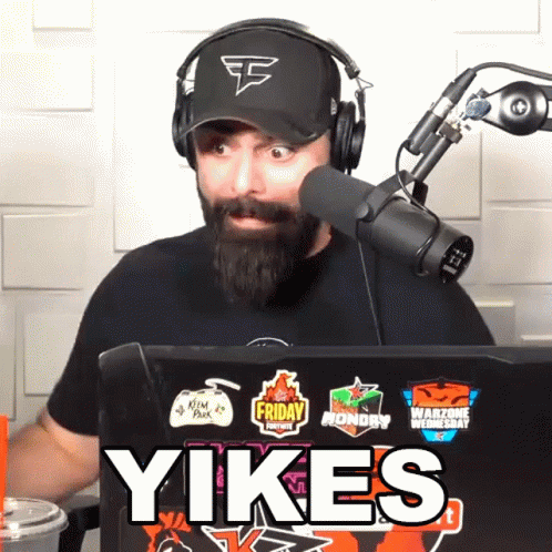 Man With Beard Wearing Headphones and Hat That Says Faze Clan
