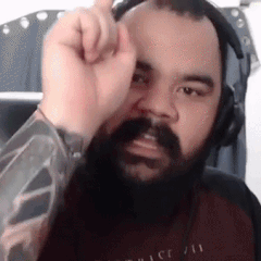 Man With Beard Wearing Headphones Making Face