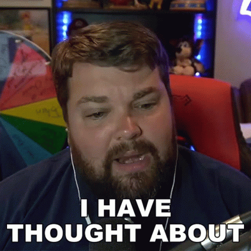 Man with Beard Wearing Headphones Saying I Have Thought About