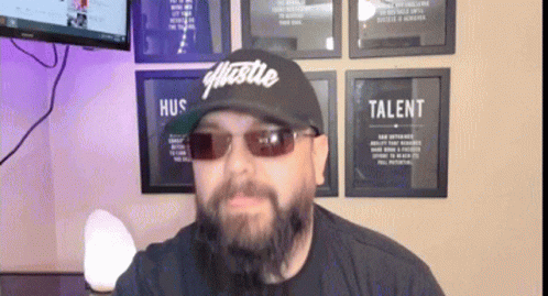 Man with Beard Wearing Hustle Hat