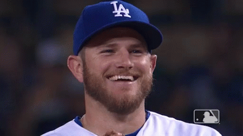 Man with Beard Wearing LA Hat Smiling