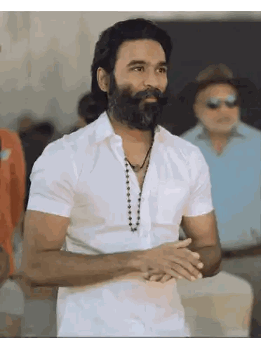 Man with Beard Wearing White Shirt and Necklace
