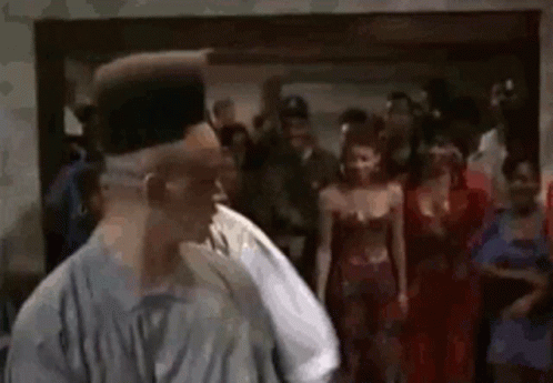Man With Big Afro Dancing in Crowd