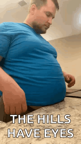 Man with Big Belly Sitting on Counter