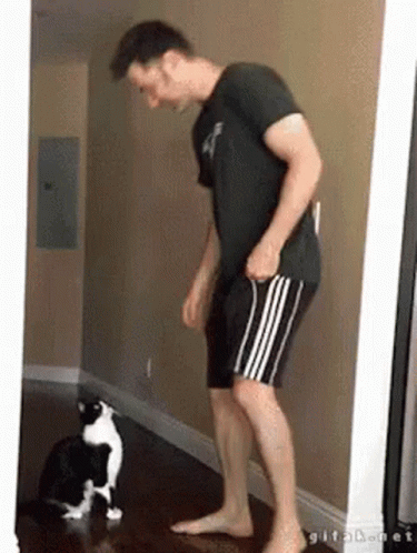 Man With Black and White Cat