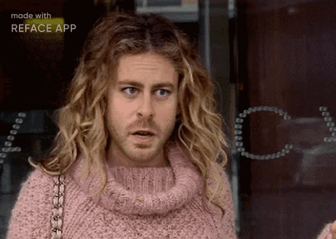 Man with Blonde Hair and Beard in Pink Sweater