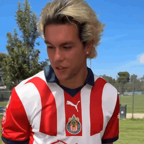 Man with Blonde Hair in Red and White Striped Shirt
