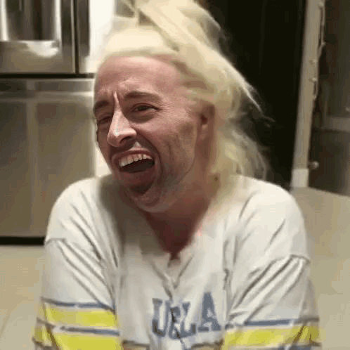 Man with Blonde Hair Making Funny Face