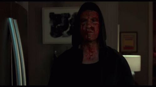 Man with Blood on Face Giving Thumbs Up