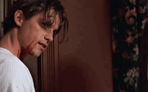 Man With Blood on Face White Sweater