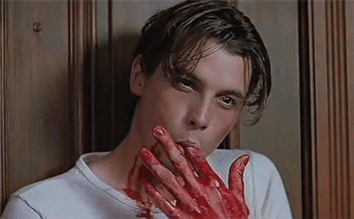 Man With Blood On Hands Biting Nails GIF