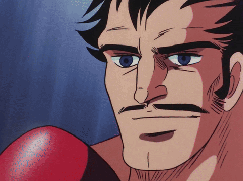 Man With Blue Eyes And Mustache In Red Boxing Gloves GIF
