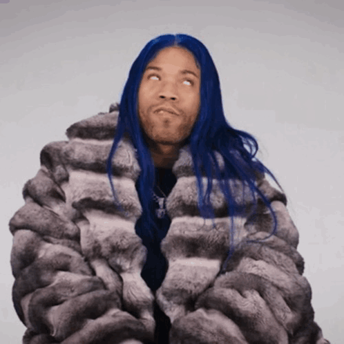 Man with Blue Hair and Fur Coat Looking Up