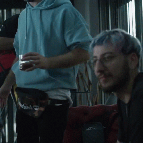 Man with Blue Hair and Glasses Looking