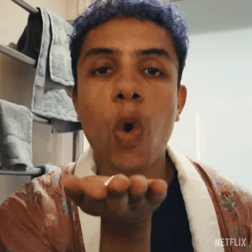 Man with Blue Hair Blowing Kiss