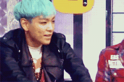 Man With Blue Hair in Black Jacket and White Shirt