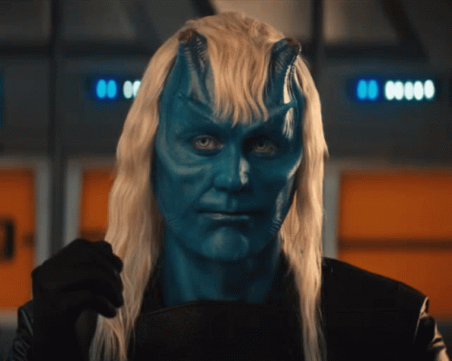 Man With Blue Paint on Face and Long Blonde Hair