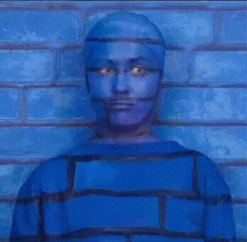 Man With Blue Painted Face Holding White iPhone