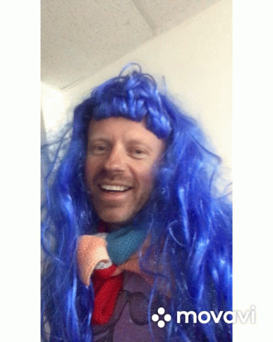 Man with Blue Wig Smiling Movado Video