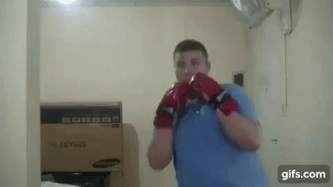 Man With Boxing Gloves and Box