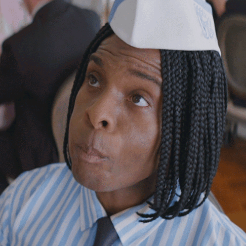 Man with Braids in Striped Shirt and Tie