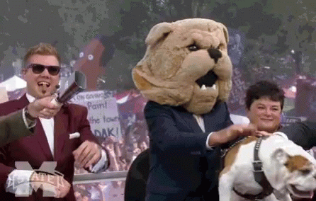 Man With Bulldog Mascot on Head and Dog