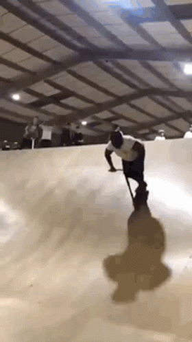 Man with Cane Riding Skateboard