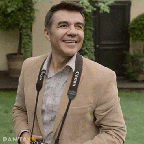 Man With Canon Camera Strap Smiling GIF