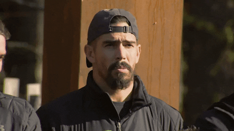 Man With Cap Nodding For The Challenge GIF