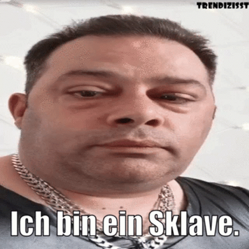 Man With Chain And Ich Bin Ein Sklave GIF