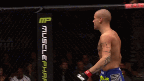 Man With Chest Tattoo In Cage With Dodge Sign GIF