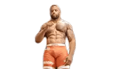 Man with Chest Tattoo in Orange Shorts