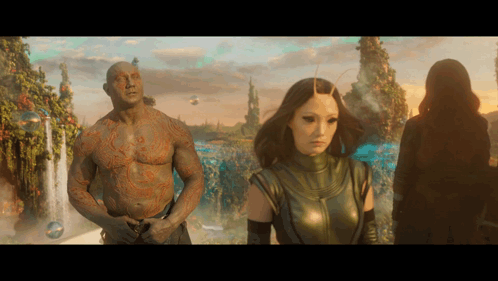 Man With Chest Tattoo Next to Woman
