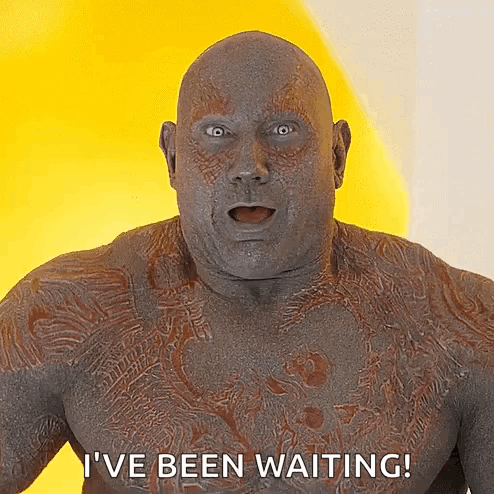 Man With Chest Tattoo Saying I've Been Waiting On Yellow Background